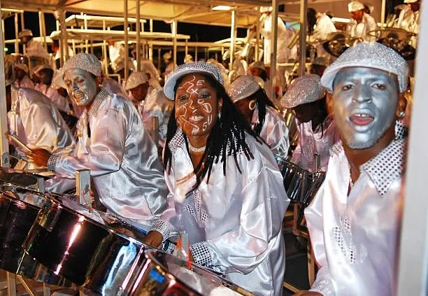 Steelband players in silver costumes and face paint
